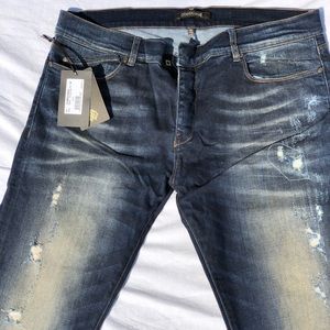 Roberto Cavalli blue jeans. NYT.